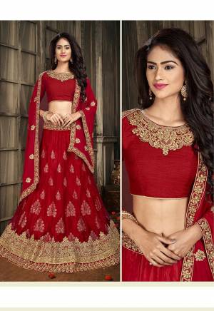 For A Proper Traditional Look, Grab This Heavy Designer Lehenga Choli In All Over Red Color. Its Blouse Is Fabricated On Art Silk Paired With Jacquard Net Lehenga And Chiffon Fabricated Dupatta. It Is Beautified With Attractive Embroidery. Buy This Pretty Piece Now.