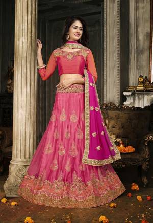 Here Is A Heavy Designer Lehenga Choli In Shades Of Pink. Its Blouse Is Fabricated On Art Silk Paired With Jacquard Net Fabricated Lehenga And Chiffon Dupatta. Its Pretty Blouse , Lehenga And Dupatta Are Beautified With Embroidery. Buy Now.