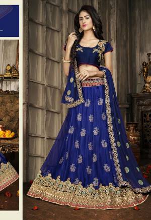 For A Proper Traditional Look, Grab This Heavy Designer Lehenga Choli In All Over Royal Blue Color. Its Blouse Is Fabricated On Art Silk Paired With Jacquard Net Lehenga And Chiffon Fabricated Dupatta. It Is Beautified With Attractive Embroidery. Buy This Pretty Piece Now.
