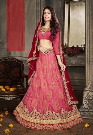 Here Is A Heavy Designer Lehenga Choli In Shades Of Pink Paired With Red Dupatta. Its Blouse Is Fabricated On Art Silk Paired With Jacquard Net Fabricated Lehenga And Chiffon Dupatta. Its Pretty Blouse , Lehenga And Dupatta Are Beautified With Embroidery. Buy Now.