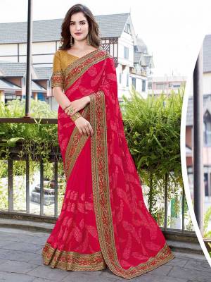 You Will Definitely Earn Lots Of Compliments Wearing This Heavy Designer Saree In Dark Pink Color Paired With Beige Colored Blouse. This Pretty Heavy Embroidered Saree Is Georgette Based Paired With Art Silk Fabricated Blouse. 