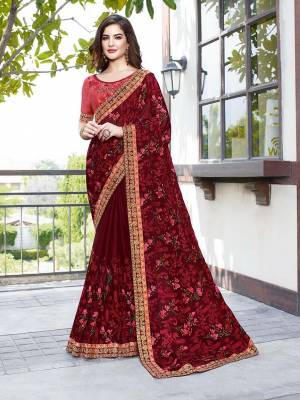 Shine Bright Wearing This Attractive Looking Heavy Designer Saree In Maroon Color Paired With Crimson Red Colored Blouse. This Saree Is Fabricated on Georgette Beautified With Embroidery Paired With Art Silk Fabricated Blouse. Buy This Designer Saree Now.
