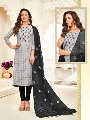 Flaunt Your Rich And Elegant Taste Wearing This Designer Staright Suit In Grey Colored Top Paired With Black Colored Bottom And Dupatta. Its Top Is Rayon Based Paired With Cotton Bottom And Cotton Silk Dupatta. 