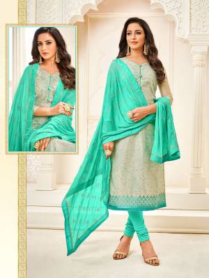Flaunt Your Rich And Elegant Taste Wearing This Designer Staright Suit In Grey Colored Top Paired With Sea Green Colored Bottom And Dupatta. Its Top Is Modal Based Paired With Cotton Bottom And Chiffon Dupatta. 