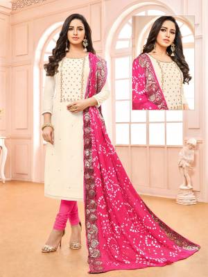 Grab This Lovely Color Pallete With This Designer Suit In Off-White Colored Top Paired With Pink Colored Bottom And Dupatta. Its Top Is Modal Based Paired With Cotton Bottom And Bandhani Jacquard Fabricated Dupatta. 