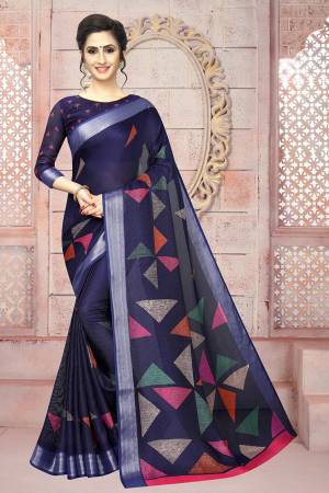 Enhance Your Personality Wearing This Saree In Navy Blue Color Paired With Navy Blue Colored Blouse. This Saree And Blouse Are Fabricated On Soft Cotton Beautified With Prints And Lace Border. 