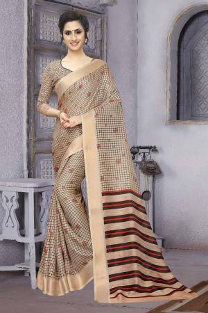 Flaunt Your Rich And Elegant Taste In This Rich Printed Saree In Beige Color Paired With Beige Colored Blouse, This Saree And  Blouse Are Soft Cotton based Beautified With Checks Prints All Over. 