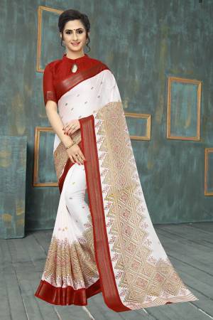 Simple And Elegant Looking Saree Is Here In White Color Paired With Maroon Colored Blouse. This Pretty Printed Saree And Blouse Are Fabricated On Soft Cotton Which Is Light Weight, Durable And Easy To Care For. 