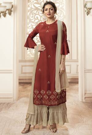 For A Royal And Elegant Look, Grab This Designer Readymade Suit In Maroon Colored Top Paired With contrasting Sand Grey Colored Bottom And Dupatta. Its Top Is Fabricated On Viscose Rayon Paired With Mal Cotton Bottom And Chiffon Dupatta. This Readymade Suit Is Available In All Sizes. Buy Now.