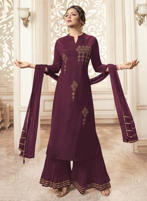 You Will Definitely Earn Lots Of Compliments Wearing This Designer Readymade Straight Cut Suit In All Over Wine Color. Its Pretty Hand Embroidered Top Is Fabricated On Viscose Rayon Paired With Cotton Bottom And Chiffon Fabricated Dupatta. Buy Now.