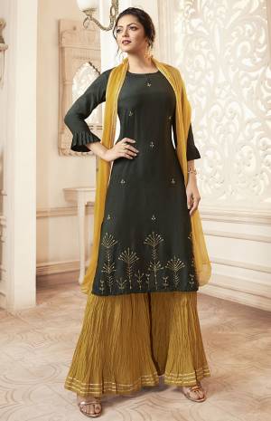 Celebrate This Festive Season With Beauty And Comfort Wearing This Lovely Designer Straight Cut Readymade Suit In Pine Green Colored Top Paired With Contrasting Musturd Yellow Colored Bottom And Dupatta. Its Top Is Fabricated Viscose Rayon Beautified With Hand Work Paired With Cotton Bottom And Chiffon Fabricated Dupatta. 