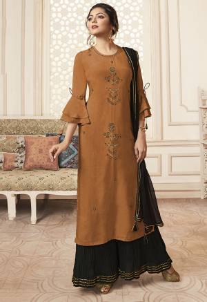 New Shade Is Here To Add Into Your Wardrobe With This Designer Readymade Straight Suit In Rust Orange Color Paired With Black Colored Bottom And Dupatta. Its Top Is Fabricated On Viscose Rayon Paired With Mal Cotton Bottom And Chiffon Fabricated Dupatta. 