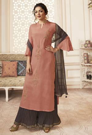 Look Pretty In This Very Beautiful Readymade Designer Suit In Dusty Pink Colored Top Paired With Dark Mauve Colored Bottom And Dupatta. Its Top Is Fabricated On Viscose Rayon Paired With Mal Cotton Bottom And Chiffon Dupatta. Its Lovely Color Pallete Will Definitely Earn You Lots Of Compliments From Onlookers.