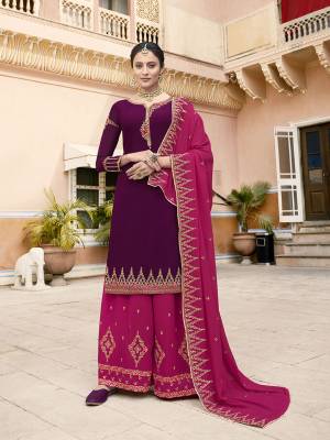 Get Ready For The Upcoming Wedding And Festive Season Wearing This Heavy Designer Suit In Dark Purple Colored Top Paired With Dark Pink Colored Bottom And Dupatta. Its Embroidered Top, Bottom And Dupatta Are Fabricated On Georgette Which Is Light In Weight And Easy To Carry Throughout The Gala. 