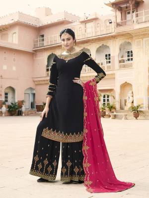 For A Bold And Beautiful Look, Grab This Heavy Designer Suit In Black Color Paired With Dark Pink Colored Dupatta. Its Top, bottom And Dupatta Are Fabricated On Georgette Beautfied With Embroidery. Buy This Semi-Sitched Suit Now.
