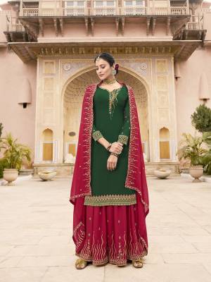 Celebrate This Festive Season Wearing This Designer Straight Suit In Dark Green Colored Top Paired With Dark Pink Colored Bottom And Dupatta. This Whole Suit Is Georgette Based Beautified With Jari & Resham Embroidery with Stone Work. 