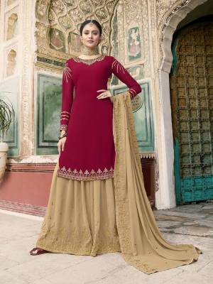 Get Ready For The Upcoming Wedding And Festive Season Wearing This Heavy Designer Suit In Maroon Colored Top Paired With Beige Colored Bottom And Dupatta. Its Embroidered Top, Bottom And Dupatta Are Fabricated On Georgette Which Is Light In Weight And Easy To Carry Throughout The Gala. 