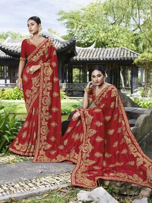 Celebrate This Festive And Wedding Season Wearing This Heavy Designer Saree In Red Color Paired With Red Colored Blouse. This Pretty Saree And Blouse Are Silk Based Beautified With Heavy Embroidery Work. 