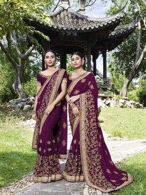 Celebrate This Festive And Wedding Season Wearing This Heavy Designer Saree In Wine Color Paired With Wine Colored Blouse. This Pretty Saree And Blouse Are Silk Based Beautified With Heavy Embroidery Work. 