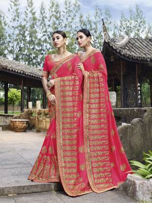 Add This Beautiful Heavy Designer Saree To Your Wardrobe In Rani Pink Color Paired With Rani Pink Colored Blouse. This Saree And Blouse Are Fabricated On Art Silk Beautified With Heavy Embroidery. 