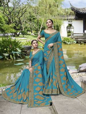 Celebrate This Festive And Wedding Season Wearing This Heavy Designer Saree In Blue Color Paired With Blue Colored Blouse. This Pretty Saree And Blouse Are Silk Based Beautified With Heavy Embroidery Work. 