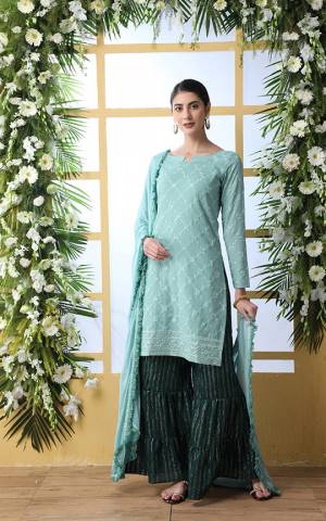 You Will Definitely Earn Lots Of Compliments Wearing This Designer Sharara Suit Suit In Sea Green Colored Top And Dupatta Paired With Pine Green Colored Bottom. This Pretty Suit Is Cotton Based Paired With Chiffon Fabricated Dupatta. 