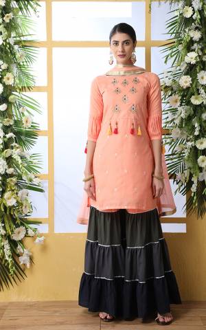Look Pretty In This Designer Sharara Suit In Peach Colored Top And Dupatta Paired With Multi Colored Bottom. This Pretty Suit Is Fabricated On Soft Cotton Paired With Chiffon Fabricated Dupatta. Buy Now. 