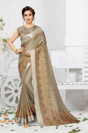 Add This Pretty Elegant Looking Saree To Your Wardrobe In Sand Grey Color. This Saree And Blouse Are Linen Based Which Gives A Rich Look To Your Personality. Buy Now.