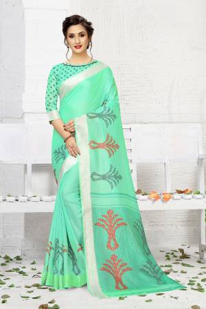 For Your Semi-Casual Wear, Grab This Lovely Printed Saree In Sea Green Color. This Saree And Blouse Are Fabricated On Linen Which Is Light Weight, Soft Towards Skin And Easy To Carry All Day Long. 