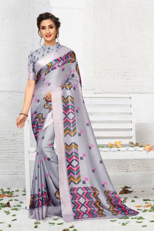 Add This Pretty Elegant Looking Saree To Your Wardrobe In Light Grey Color. This Saree And Blouse Are Linen Based Which Gives A Rich Look To Your Personality. Buy Now.
