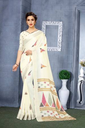 For Your Semi-Casual Wear, Grab This Lovely Printed Saree In Cream Color. This Saree And Blouse Are Fabricated On Linen Which Is Light Weight, Soft Towards Skin And Easy To Carry All Day Long. 
