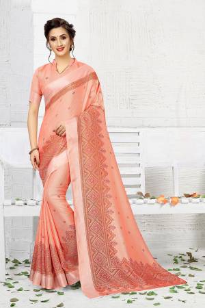 Add This Pretty Elegant Looking Saree To Your Wardrobe In Dark Peach Color. This Saree And Blouse Are Linen Based Which Gives A Rich Look To Your Personality. Buy Now.