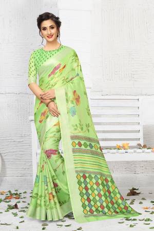 For Your Semi-Casual Wear, Grab This Lovely Printed Saree In Green Color. This Saree And Blouse Are Fabricated On Linen Which Is Light Weight, Soft Towards Skin And Easy To Carry All Day Long. 
