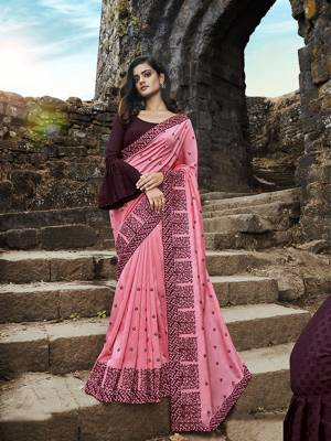 Look Pretty In This Very Beautiful Heavy Designer Saree In Pink Color Paired With Contrasting Wine Colored Blouse. This Saree Is Fabricated on Soft Silk Paired With Jacquard Cotton Blouse. 