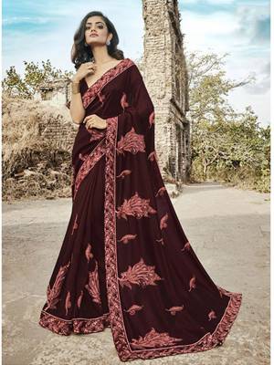 For A Royal Look, Grab This Heavy Designer Saree In Maroon Color Paired With Maroon Colored Blouse. This Saree And Blouse Are Silk Based Beautified With Contrasting  Attractive Embroidery. Buy This Saree Now.