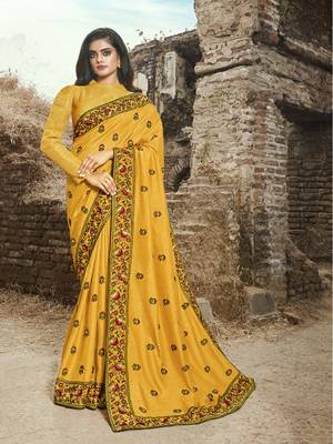 Celebrate This Festive Season Wearing This Heavy Designer Saree In Yellow Color Paired With Yellow Colored Blouse. This Saree Is Fabricated On Art Silk Paired With Jacquard Silk Fabricated Blouse. 
