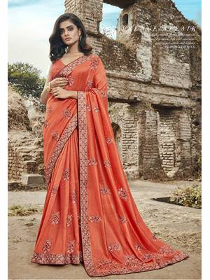 Celebrate This Festive Season Wearing This Heavy Designer Saree In Orange Color Paired With Orange Colored Blouse. This Saree Is Fabricated On Art Silk Paired With Jacquard Silk Fabricated Blouse. 