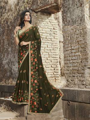Look Pretty In This Very Beautiful Heavy Designer Saree In Dark Green Color Paired With Light Green Colored Blouse. This Saree Is Fabricated on Soft Silk Paired With Art Silk Blouse. 