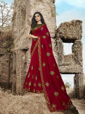 Here Is An Evergreen Color Pallete With This Heavy Designer Saree In Red Color Paired With Olive Green Colored Blouse. This Saree IS Fabricated On Soft Silk Paired With Jacquard Silk Fabricated Blouse. 