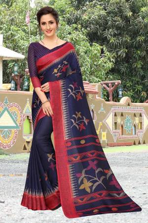 Add This Pretty Elegant Looking Saree To Your Wardrobe In Navy Blue Color. This Saree And Blouse Are Linen Based Which Gives A Rich Look To Your Personality. Buy Now.