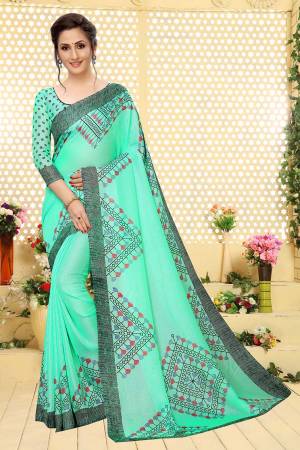 For Your Semi-Casual Wear, Grab This Lovely Printed Saree In Sea Green Color. This Saree And Blouse Are Fabricated On Linen Which Is Light Weight, Soft Towards Skin And Easy To Carry All Day Long. 