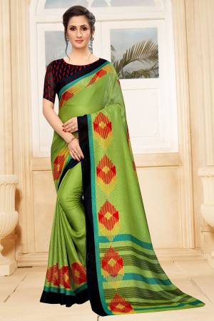 For Your Semi-Casual Wear, Grab This Lovely Printed Saree In Parrot Green Color. This Saree And Blouse Are Fabricated On Linen Which Is Light Weight, Soft Towards Skin And Easy To Carry All Day Long. 