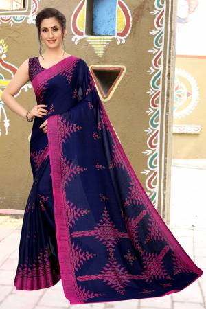 For Your Semi-Casual Wear, Grab This Lovely Printed Saree In Navy Blue Color. This Saree And Blouse Are Fabricated On Soft Cotton Which Is Light Weight, Soft Towards Skin And Easy To Carry All Day Long. 