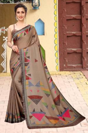 Add This Pretty Elegant Looking Saree To Your Wardrobe In Sand Grey Color. This Saree And Blouse Are Soft Cotton Based Which Gives A Rich Look To Your Personality. Buy Now.