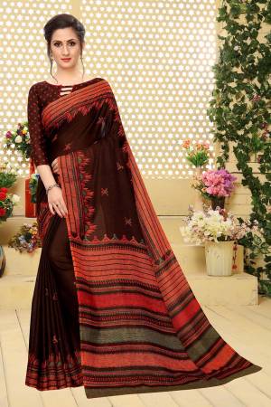 For Your Semi-Casual Wear, Grab This Lovely Printed Saree In Brown Color. This Saree And Blouse Are Fabricated On Soft Cotton Which Is Light Weight, Soft Towards Skin And Easy To Carry All Day Long. 