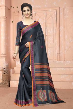Add This Pretty Elegant Looking Saree To Your Wardrobe In Dark Grey Color. This Saree And Blouse Are Soft Cotton Based Which Gives A Rich Look To Your Personality. Buy Now