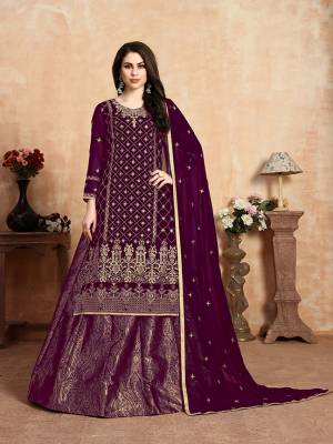 Here Is A Beautiful Heavy Designer Lehenga Suit In All Over Wine Color. Its Embroidered Top and Dupatta Are Fabricated On Georgette Paired With Jacquard Silk Fabricated Lehenga. It Beautiful Pattern and Color Will Definitely Earn You Lots Of Compliments From Onlookers. 
