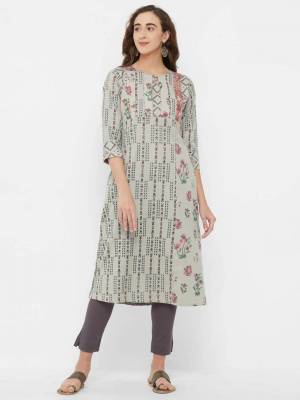 Add This Beauitful Readymade Kurti To Your Wardrobe In Grey Color Fabricated On Rayon. This Kurti Is Beautified With Prints all Over And Minimal Embroidery. 