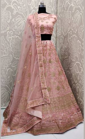 Look The Most Elegant Of All This Wedding Season Wearing This Heavy Designer Lehenga Choli In Pink Color. This Beautiful Heavy Tone To Tone Embroidered Lehenga Choli Is Fabricated On Net. Its Rich Color and Detailed Embroidery Will earn You Lots Of Compliments From Onlookers 