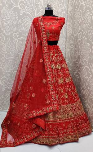 Look The Most Elegant Of All This Wedding Season Wearing This Heavy Designer Lehenga Choli In Red Color. This Beautiful Heavy Tone To Tone Embroidered Lehenga Choli Is Fabricated On Net. Its Rich Color and Detailed Embroidery Will earn You Lots Of Compliments From Onlookers 